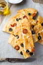 Homemade focaccia with black olives, cherry tomatoes, rosemary and salt Royalty Free Stock Photo