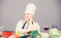 Homemade food tips. Turn ingredients into delicious meal. Culinary skills. Woman chef wear hat apron near table Royalty Free Stock Photo