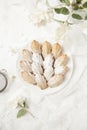 Homemade French cookies cakes Madeleine with jasmine tea on white background with fresh syringa floweres