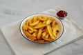 Homemade French Fries with Ketchup on a Plate, side view. Close-up Royalty Free Stock Photo