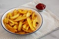 Homemade French Fries with Ketchup on a Plate, side view. Close-up Royalty Free Stock Photo