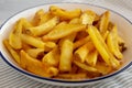 Homemade French Fries on a Plate, side view. Close-up Royalty Free Stock Photo