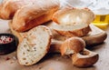 Homemade french two Baguette loafs and cut slice on wooden cutting board Royalty Free Stock Photo