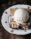 Homemade fresh blueberry pie with ice-cream on rustic background Royalty Free Stock Photo