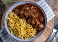 Hungarian goulash with spaetzle noodles on a plate Royalty Free Stock Photo