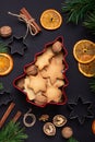 Homemade fresh cookies in a tin box Fir branches Dried slices of orange Cookie cutters Christmas concept Royalty Free Stock Photo