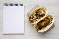 Homemade Fresh Fish Tacos, blank notepad, top view. Flat lay, overhead, from above. Close-up