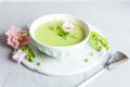 Homemade fresh green pea cream soup with pea sprouts and flowers Royalty Free Stock Photo