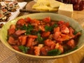 Homemade Fresh Juicy Tomato Salad with Arugula Leaves in Ceramic Bowl. Royalty Free Stock Photo