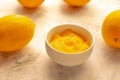 Homemade fresh pudding or tangy lemon curd in a white bowl.Selective focus