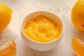 Homemade fresh pudding or tangy lemon curd in a white bowl.Selective focus