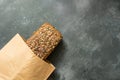 Homemade fresh rye bread with sunflower seeds on dark board. Close up. Copy space. Royalty Free Stock Photo