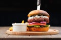 Homemade and Fresh Tasty Burger on Wooden Board Royalty Free Stock Photo