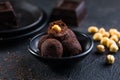 Homemade fresh truffle dark chocolate candies with cocoa powder made by chocolatier. Gourmet food, delicious dessert Royalty Free Stock Photo