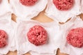 Homemade Fresh Uncooked Beef Meatballs on White Paper Semi Finished Meat Product Top View Horizontal