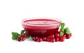 Homemade fresh wild lingonberry sauce in small glass bowl isolated on white background