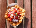 Homemade freshly baked belgian waffles with ice cream and fruites on wooden table. Royalty Free Stock Photo