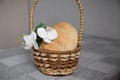 Homemade freshly baked bread is in a basket on the table. There are Orchid flowers next to it Royalty Free Stock Photo