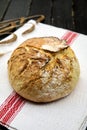 Homemade freshly baked bread on a napkin.