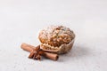 Homemade freshly baked pumpkin muffins with oatmeal and nuts on beige textured background Royalty Free Stock Photo