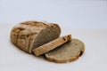 Homemade freshly baked rye and wheat loaf of bread on white background. Concept of health and huger. Organic Food concept Royalty Free Stock Photo