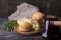 Homemade freshly baked scones with cheese and herbs, turk coffee on wooden board on wooden table