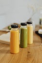 Homemade freshly squeezed juice in bottles on a table