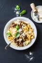 Homemade freshness pappardelle pasta with beef bolognese sauce on a dark background