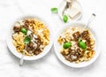 Homemade freshness pappardelle pasta with beef bolognese sauce on a light background. Served lunch table. Top view