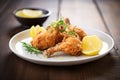 homemade fried chicken with lemon wedges Royalty Free Stock Photo