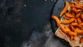 Homemade Fries Orange Sweet Potato with lime and herbs on dark background. Long banner format. top view Royalty Free Stock Photo