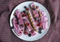 Homemade frozen yogurt bars with raspberries and blueberries. Snack for the summer days Royalty Free Stock Photo