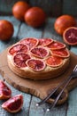 Homemade fruit cake. Blood orange cake on oak board with raw ora Royalty Free Stock Photo