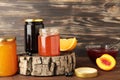 Homemade fruit jam in the jar on brown background. Top view Royalty Free Stock Photo