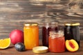 Homemade fruit jam in the jar on brown background. Top view Royalty Free Stock Photo