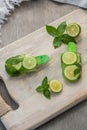 Homemade fruit popsicle stick. Delicious homemade lime mint popsicle stick on light background Royalty Free Stock Photo
