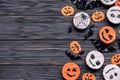 Homemade funny spooky cookies on happy Halloween background, copy space