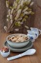 Homemade Gadola, Cereal and Nuts in Ceramic Bowl served with Almond Milk