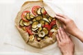 Homemade galette pie with grilled eggplants, tomatoes and onion. Top view Royalty Free Stock Photo