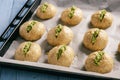 Homemade garlic bread rolls on wooden background.