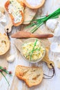 Homemade garlic butter with chives and fresh roasted baguette with salt Royalty Free Stock Photo