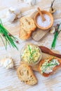 Homemade garlic butter with chives and fresh roasted baguette with salt