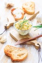 Homemade garlic butter with herbs and chives and fresh roasted baguette Royalty Free Stock Photo