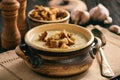 Homemade garlic cream soup with croutons.