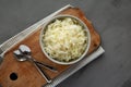 Homemade German Sauerkraut in a Bowl on a gray background, top view