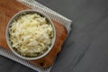 Homemade German Sauerkraut in a Bowl on a gray background, top view