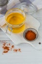 Homemade Ghee or clarified butter in a jar and paprika powder on white wooden table. Royalty Free Stock Photo