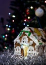 Homemade gingerbread Christmas house with night bokeh background Royalty Free Stock Photo