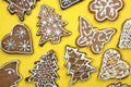 Homemade gingerbread cookies for Christmas on a yellow background. Royalty Free Stock Photo