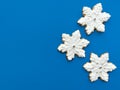 Homemade gingerbread cookies in the form of snowflakes decorated with snow white icing Royalty Free Stock Photo